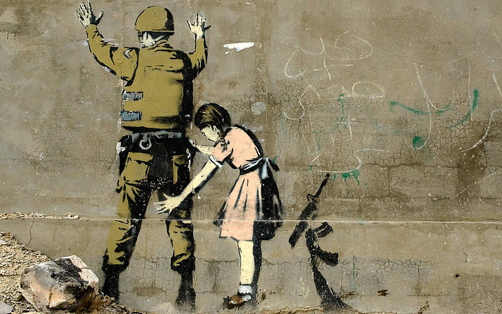Graffiti de Bansky. Una niña revisa a un soldado